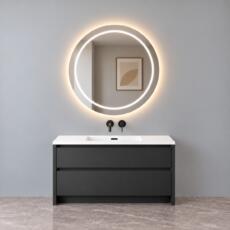 Ronde LED spiegel met verlichte binnenrand en rondom verlichting boven een wastafel.